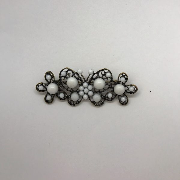Broche flamenco mariposa fabricado en oro viejo y medias perlas de colores para combinar con tus accesorios de flamenca