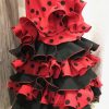 Falda de flamenca roja con lunar negro de tejido streck muy movida para tus bailes