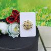 Broche dorado forma de flor