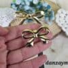 Broche flamenco dorado