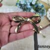 Broche flamenco dorado