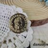 Broche redondo dorado