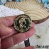 Broche redondo dorado