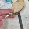 Broche flamenca pájaro dorado con diseño elegante y brillante danzaymas2